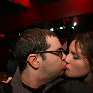 Midnight Kiss at a Dimly Lit Bar