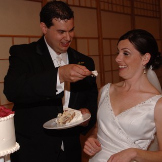 Bride and Groom Share Wedding Cake Feeding Moment