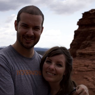 Couple Smiling Atop Sedona's Red Rock Formations