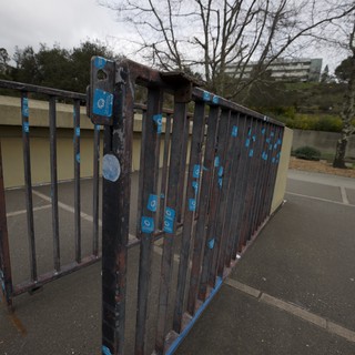 Weathered Metal Gate with Peeling Blue Paint
