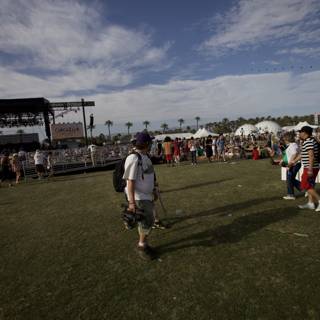 Coachella Sunday Crowd Walking on Grassy Field