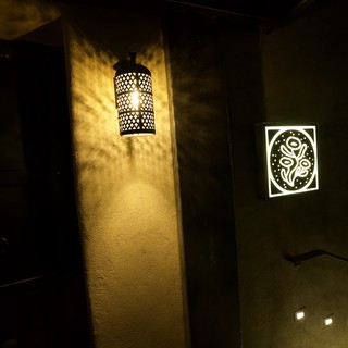 Moroccan-Inspired Lantern Casting Shadows in Dark Corridor