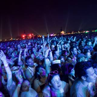 Hands Up in the Night Sky at Coachella
