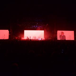 Red Lights Illuminate Concert Screen