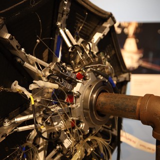 Vintage Aircraft Engine with Curved Exhaust Pipe Display