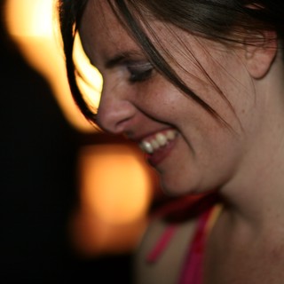 Laughing Woman Glowing in Warm Party Light