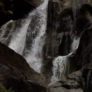Rushing Waters Through Dark Granite Gorge