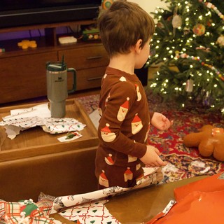 Christmas Morning Gift Opening in Festive Living Room