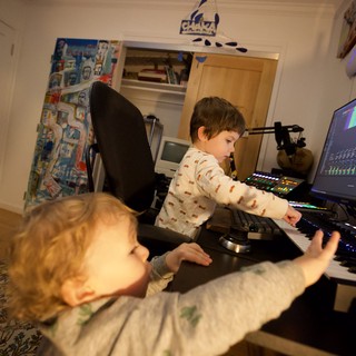 Young Brothers Making Music Together at Night