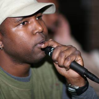 Steve J Performing with Green Shirt and Mic