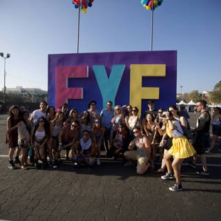 Group photo in front of the FYF sign