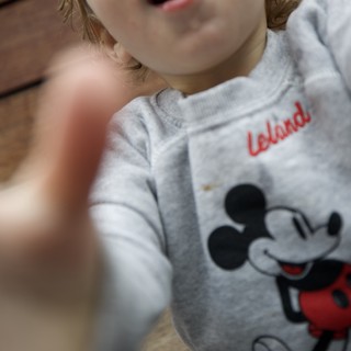 Child in Mickey Mouse Sweatshirt with Personalized Name