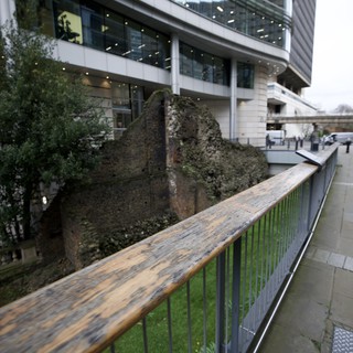 Ancient Roman Wall Ruins Amid Modern London Architecture