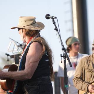 Cowboy Hat + Guitar = Entertainment