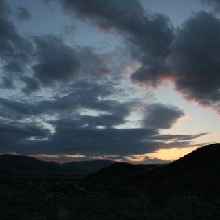 Desert Sunset with Clouds and Hills