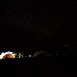 Mountain Tent Glowing Under the Night Sky