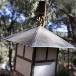 Craftsman-Style Outdoor Lantern Among Pine Trees