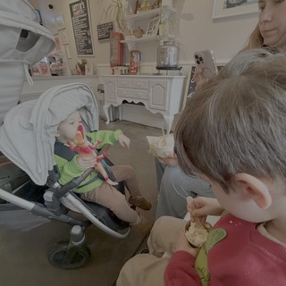 Mother and Children Enjoying Cozy Cafe Time