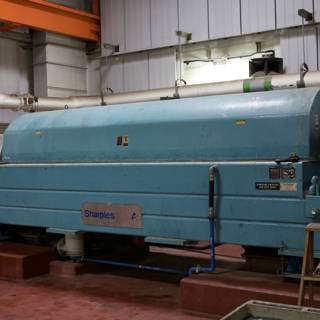 Massive Blue Turret Machine in Warehouse