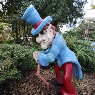 Whimsical Uncle Sam Garden Statue in Lush Setting
