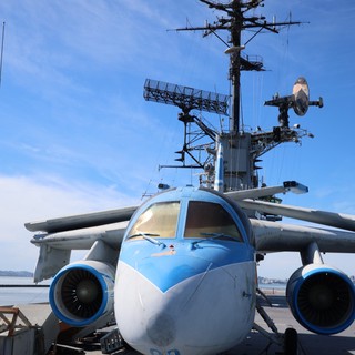 Military Aircraft on Aircraft Carrier Deck at Sunset