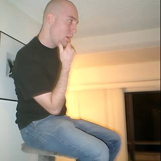 Bald Man Lounging in Comfortable Jeans