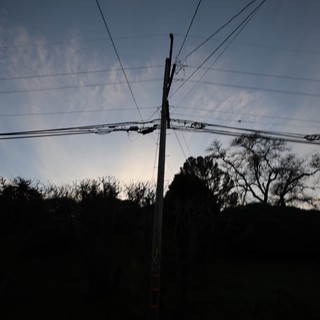 Power Lines Against Twilight Sky at Dusk