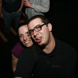Two Friends Posing Together at a Nighttime Event