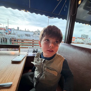Waterfront restaurant or boat dining area in an urban harbor