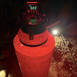 Digital Angle Gauge on Concrete Pier at Night