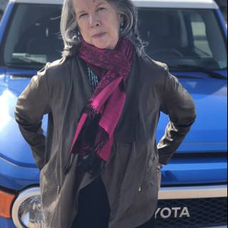 Stylish Rhoda B poses in front of her blue Toyota truck
