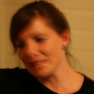Candid Moment: Woman in Warm Indoor Light