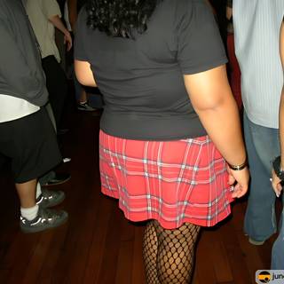 Plaid Skirt and Fishnets in the Crowd
