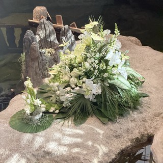 Memorial Floral Arrangement on Rocky Water Feature