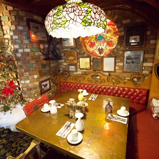 Cozy Christmas Corner with Tiffany Lamp and Red Leather Booth