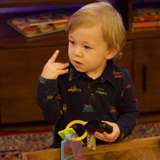 Toddler Playing with Toys on Christmas Eve