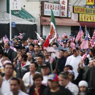 Patriotic Crowd Holds American Flags in the Street