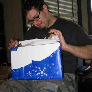 Man Unwrapping Gift on Christmas Eve