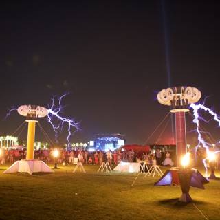 Outdoor Concert Crowd Gathers under Massive Light Pole