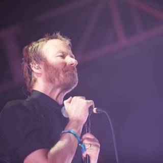 Matt Berninger Shreds it on Stage with Microphone in Hand