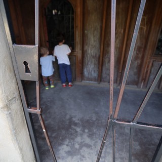 Children Entering Through Historic Church Doorway