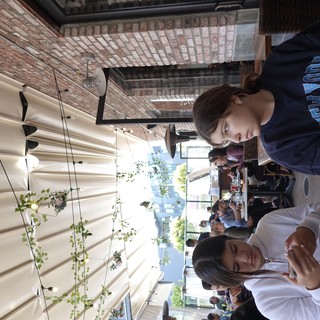 Friends Dining at Trendy Outdoor Restaurant Patio