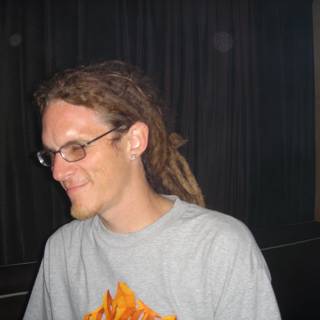 Portrait of a Man with Dreadlocks and Glasses