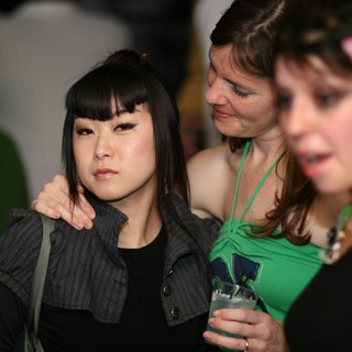 Three Women at a Nighttime Social Event 2006