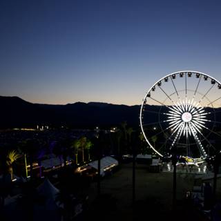 Nighttime Ferris Wheel with Mountain View