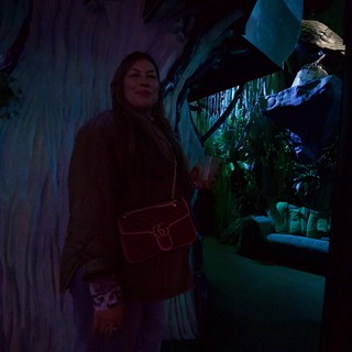 Woman Posing in Enchanted Forest Themed Exhibit