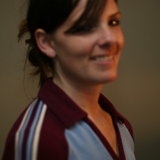 Smiling Woman in Casual Portrait with Bokeh