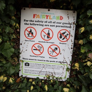 Children's Fairyland Safety Rules Sign Among Ivy
