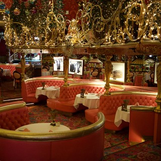 Opulent Holiday-Decorated Restaurant with Circular Booth Seating