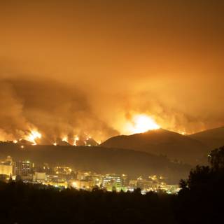 Flames Ravage Hills Above City